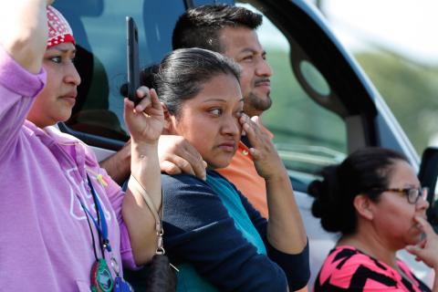 At the Koch Food Mill in Morton, Mississippi, witnesses and family members of detained individuals witnessed an unprecedented immigration operation by authorities in 2019. (AP/Rogelio V. Solis)